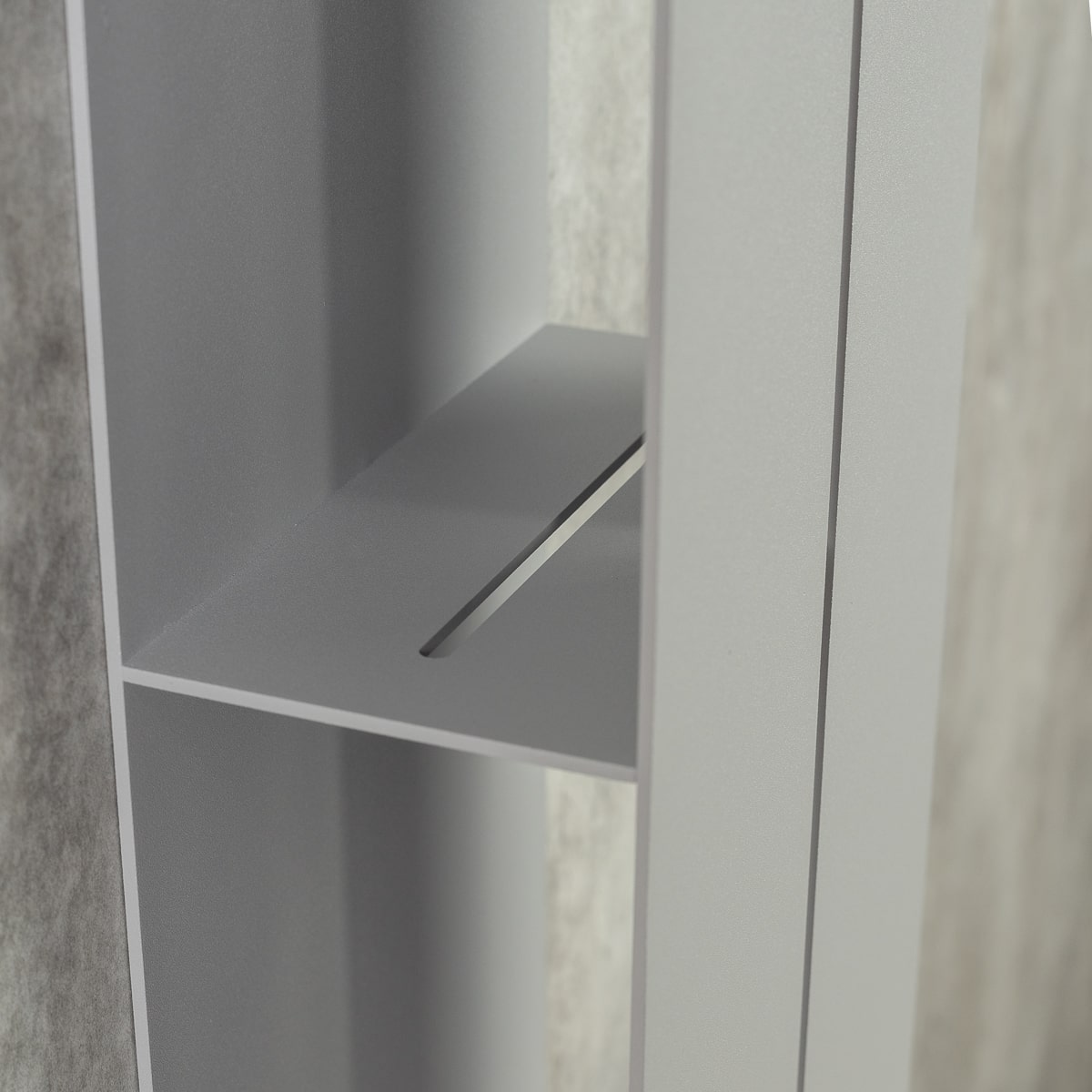 a close-up view of the inside of a gray vertical organizer, focuses on one of the hidden shelves, clean lines and minimalist design of the organizer.