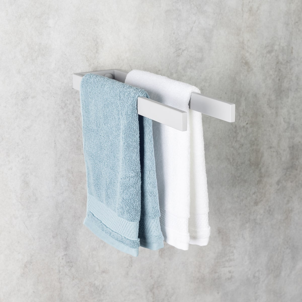 wall-mounted towel holder made of stainless steel, side view, holding two towels, modern bathroom accessory